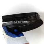 Staple set flexible brush seal with rubber profile