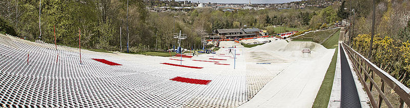 Large commercial dry ski slope covered with brush mat surface
