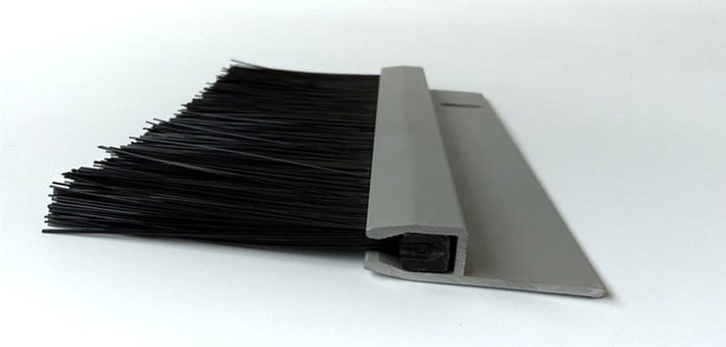 Cable grommet brush with a rigid PVC base inserted into an aluminum holder