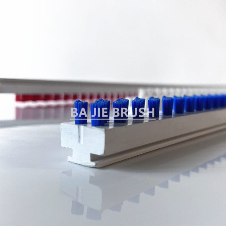 C Track lath brush with blue bristle tufts in a replaceable plastic base