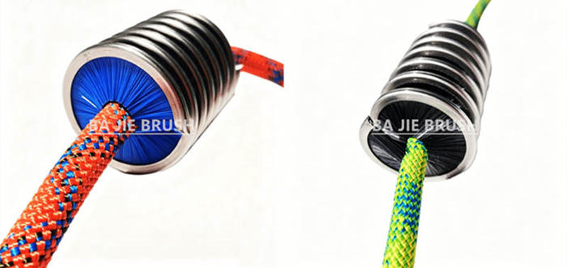 Climbing rope passing through inward-facing nylon bristles for 360-degree cleaning