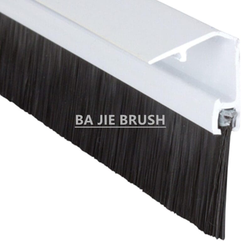PVC door brush seal with a clip-on cover that conceals the fixing screws