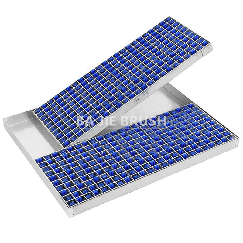Modular wheel cleaning mats fitted with blue angled lath brushes