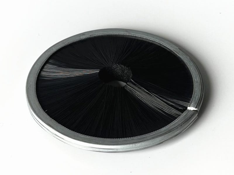 Metal ring brush with inward-facing black bristles