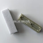 Nonwoven needleloom brush with nylon bristles