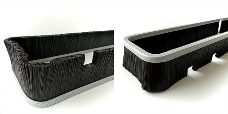 Black filament rectangular strip brush formed to match a vacuum cleaner nozzle