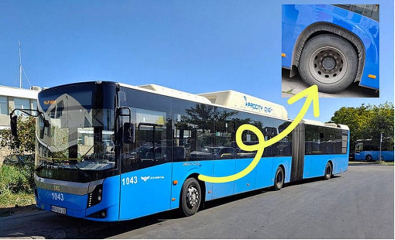 Bus showing the installation position of a 90 degree side-tufted strip brush above the wheel