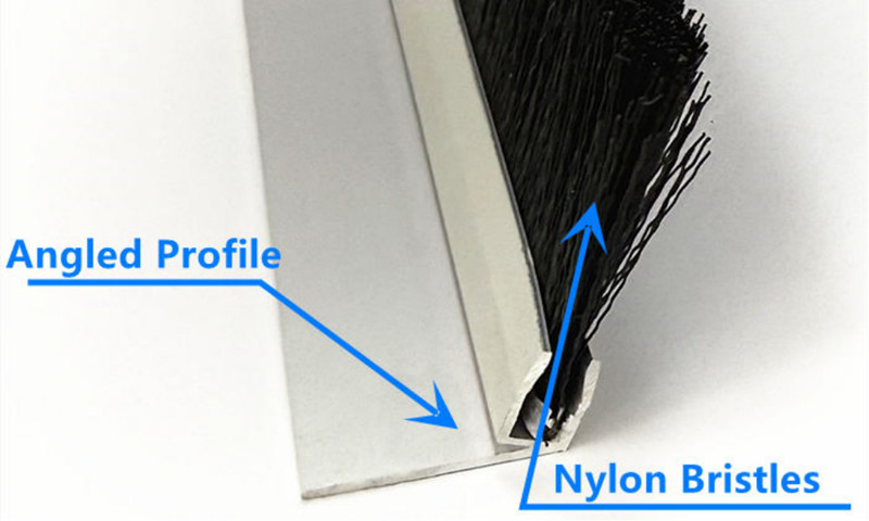 Barn Door Brush Seal Structure Close-up of a barn door brush seal showing the angled aluminum profile and black nylon bristles