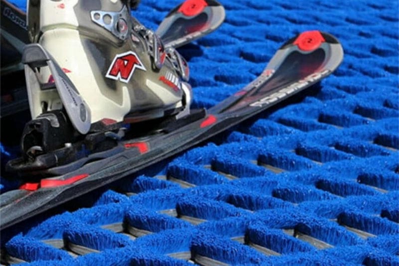 Blue diamond-pattern dry ski slope mat made from PBT strip brushes