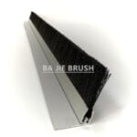 Sliding barn door brush seal with black bristles and an aluminum mounting profile