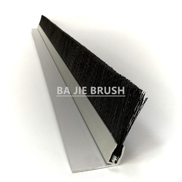 Sliding barn door brush seal with black bristles and an aluminum mounting profile