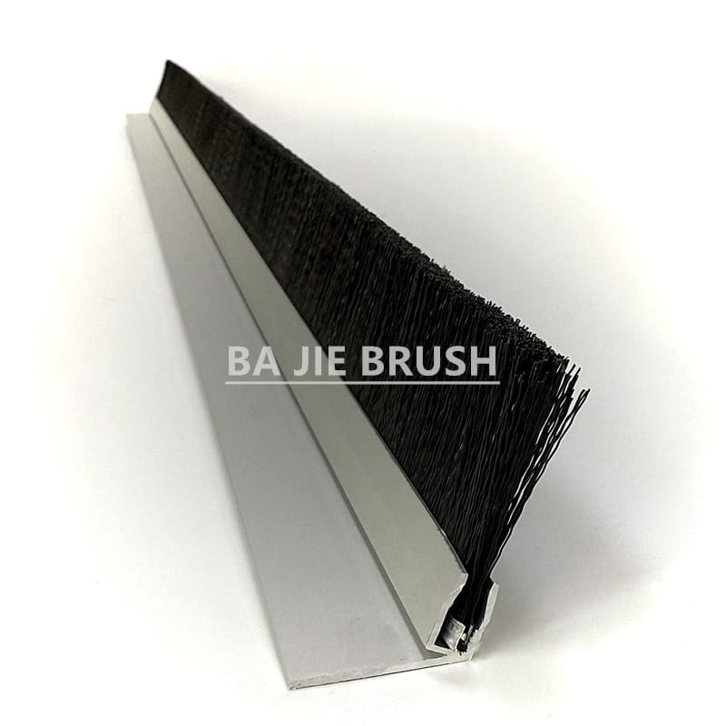 Sliding barn door brush seal with black bristles and an aluminum mounting profile